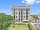 Stunning exterior shot of an upscale multi-Gathering building and manicured lawn at 2109 Bayshore Blvd # 704, Tampa, FL 33606
