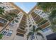 Low angle view of a multi-story building featuring stucco walls, balconies, and a blue sky backdrop at 2109 Bayshore Blvd # 704, Tampa, FL 33606