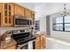 Updated kitchen features stainless steel appliances and views of the city and water at 2109 Bayshore Blvd # 704, Tampa, FL 33606