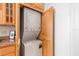 Laundry room features a stackable washer and dryer behind wood doors at 2109 Bayshore Blvd # 704, Tampa, FL 33606