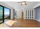 Living room features wood floors, ceiling fan, and balcony access with stunning water views at 2109 Bayshore Blvd # 704, Tampa, FL 33606