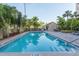 Inviting outdoor pool surrounded by lush tropical landscaping, providing a serene retreat at 2109 Bayshore Blvd # 704, Tampa, FL 33606