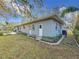 Landscaped backyard with patio and spacious lawn at 2446 Belleair Rd, Clearwater, FL 33764