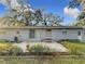 Spacious backyard with patio and well-maintained landscaping at 2446 Belleair Rd, Clearwater, FL 33764