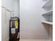 Unfinished basement with shelving and water heater at 2446 Belleair Rd, Clearwater, FL 33764