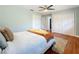 Serene bedroom with hardwood floors, ceiling fan, and double closets at 2446 Belleair Rd, Clearwater, FL 33764