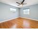 Spacious bedroom with hardwood floors and ceiling fan at 2446 Belleair Rd, Clearwater, FL 33764