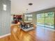 Open concept dining area with kitchen view and access to backyard patio at 2446 Belleair Rd, Clearwater, FL 33764