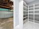 Garage with built-in shelving and extra storage space at 2446 Belleair Rd, Clearwater, FL 33764