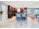 Updated kitchen featuring dark cabinets and marble floors at 2446 Belleair Rd, Clearwater, FL 33764