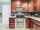 Well-equipped kitchen featuring stainless steel appliances and granite countertops at 2446 Belleair Rd, Clearwater, FL 33764
