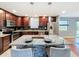 Stylish kitchen with granite island and stainless steel appliances at 2446 Belleair Rd, Clearwater, FL 33764