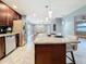 Updated kitchen featuring granite island, stainless steel appliances, and wood cabinetry at 2446 Belleair Rd, Clearwater, FL 33764