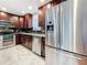 Updated kitchen with stainless steel appliances and granite countertops at 2446 Belleair Rd, Clearwater, FL 33764