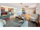 Open living room, hardwood floors, and view of kitchen at 2446 Belleair Rd, Clearwater, FL 33764