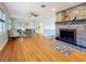 Spacious living room with hardwood floors and fireplace at 2446 Belleair Rd, Clearwater, FL 33764