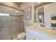 Clean bathroom with walk-in shower and modern vanity at 29555 Zupetta Ln, Wesley Chapel, FL 33545