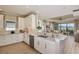 Modern kitchen with white cabinets, granite countertops, and stainless steel appliances at 29555 Zupetta Ln, Wesley Chapel, FL 33545