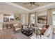 Spacious living room with light beige furniture and large windows at 29555 Zupetta Ln, Wesley Chapel, FL 33545