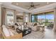 Living area with sliding glass doors opening to a patio at 29555 Zupetta Ln, Wesley Chapel, FL 33545