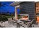 Modern outdoor fireplace with seating area at 29555 Zupetta Ln, Wesley Chapel, FL 33545