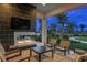 Relaxing outdoor patio with a fire pit and comfortable seating at 29555 Zupetta Ln, Wesley Chapel, FL 33545