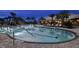 Resort-style pool with lounge chairs and palm trees at 29555 Zupetta Ln, Wesley Chapel, FL 33545