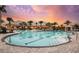Expansive resort-style pool at sunset at 29555 Zupetta Ln, Wesley Chapel, FL 33545