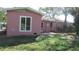 Back of the home featuring additional back entrance, patio area and lush greenery at 3083 55Th N Ave, St Petersburg, FL 33714