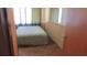 Cozy bedroom with wood-look flooring, wainscoting, and ample natural light at 3083 55Th N Ave, St Petersburg, FL 33714