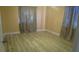 Cozy bedroom with natural light, curtains and hardwood floors at 3083 55Th N Ave, St Petersburg, FL 33714