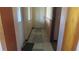 Welcoming entryway featuring tiled flooring, a storm door, and a coat closet at 3083 55Th N Ave, St Petersburg, FL 33714