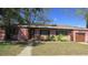 Charming single-story home with a well-maintained lawn, mature trees, and attached one car garage at 3083 55Th N Ave, St Petersburg, FL 33714
