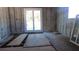 A look at the interior of the property, which is under construction, with a sliding glass door at 3083 55Th N Ave, St Petersburg, FL 33714