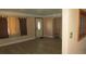Cozy living room featuring wood-look floors, neutral walls, front door, and natural light at 3083 55Th N Ave, St Petersburg, FL 33714