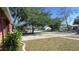 Street view of home in quiet neighborhood, highlighting landscaping and street parking at 3083 55Th N Ave, St Petersburg, FL 33714