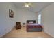 Bright bedroom with a double bed, chair, and ceiling fan at 3145 Meta Ct, Largo, FL 33771