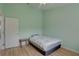 Light and airy bedroom with wood floors and ceiling fan at 3145 Meta Ct, Largo, FL 33771