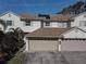 Two-story house with a two-car garage and solar panels at 3145 Meta Ct, Largo, FL 33771