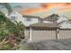 Two-story townhome with attached garage and landscaping at 3145 Meta Ct, Largo, FL 33771