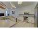 Spacious kitchen featuring stainless steel appliances and island at 3145 Meta Ct, Largo, FL 33771