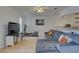 Living room featuring a large sectional sofa and flat screen tv at 3145 Meta Ct, Largo, FL 33771