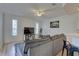 Living room with hardwood floors, large TV, and comfortable seating at 3145 Meta Ct, Largo, FL 33771
