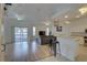 Open living space featuring hardwood floors and a view of kitchen at 3145 Meta Ct, Largo, FL 33771