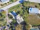 Aerial view of home showing yard, driveway, and surrounding area at 3476 Tidewater Dr, Weeki Wachee, FL 34607