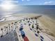 An aerial view shows an expanse of beach with palm trees, picnic shelters, and ocean views at 3476 Tidewater Dr, Weeki Wachee, FL 34607
