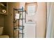 Small bathroom featuring white pedestal sink and a round mirror at 3476 Tidewater Dr, Weeki Wachee, FL 34607