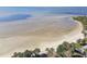 Aerial view of beach, water and house at 3476 Tidewater Dr, Weeki Wachee, FL 34607