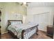 Bedroom featuring a queen bed, ceiling fan, and neutral decor at 3476 Tidewater Dr, Weeki Wachee, FL 34607