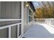 View of deck featuring door to the house and an awning for shade at 3476 Tidewater Dr, Weeki Wachee, FL 34607